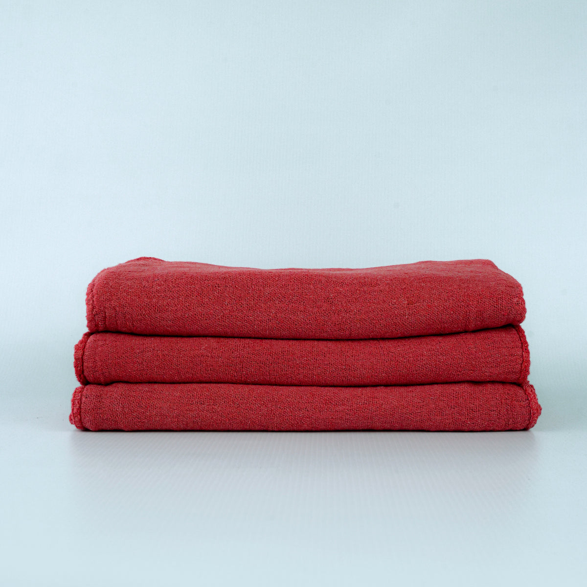 Manufacturer photograph of red dyed shop towels; shared color-family image.