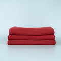 Manufacturer photograph of red dyed shop towels; shared color-family image.