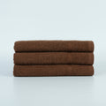 HR Cotton brown 16x27 vat-dyed ring-spun hand towel. Supplier product photograph.