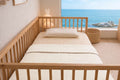 Sleep & Beyond Romi & Rani Organic Cotton Muslin Swaddle. Supplier family gallery explicitly contains this crib/color image. Styling only; only SKU contents included.